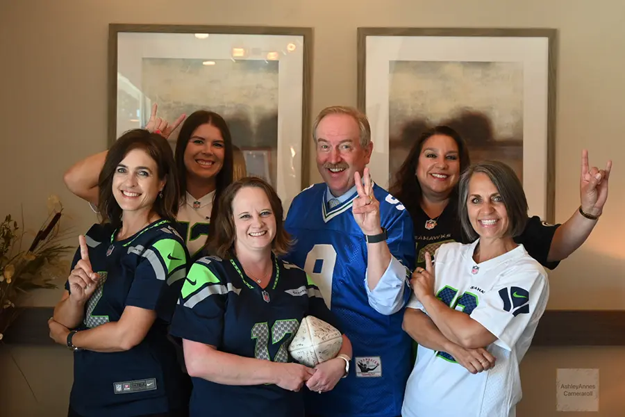 Team in Seattle Seahawks apparel at Karl Hoffman Dentistry in Lacey, WA