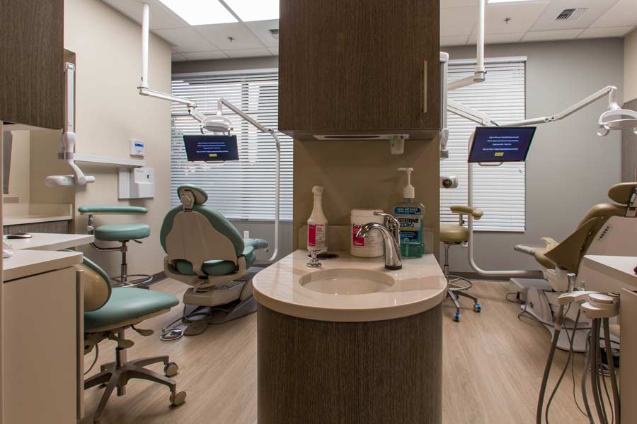 Exam rooms with dental chairs and sink at Karl Hoffman Dentistry in Lacey, WA