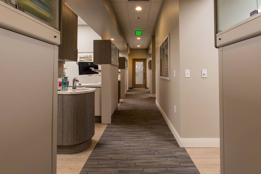 Hallway area with entrances to dental exam rooms at Karl Hoffman Dentistry in Lacey, WA