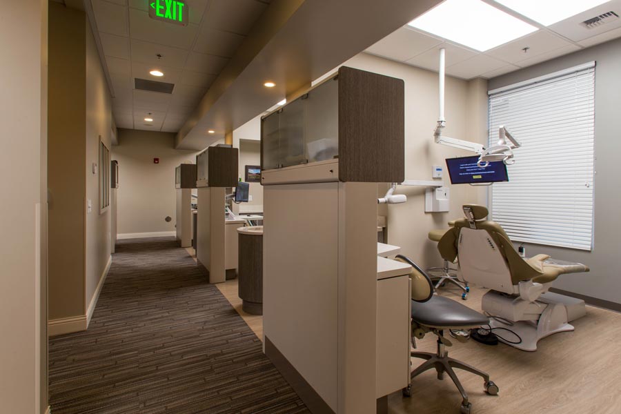 Hallway area view of dental exam rooms and dental chair at Karl Hoffman Dentistry in Lacey, WA 