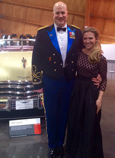 Man in military uniform with arm around woman, patients at Karl Hoffman Dentistry in Lacey, WA