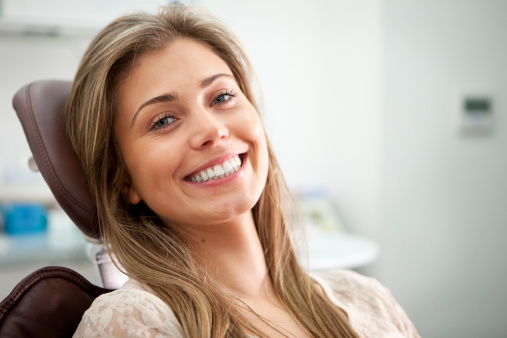 Woman smiling in dental chair at Karl Hoffman Dentistry in Lacey, WA