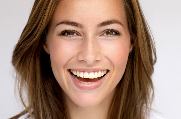 Beautiful woman smiling after teeth whitening at Karl Hoffman Dentistry in Lacey, WA